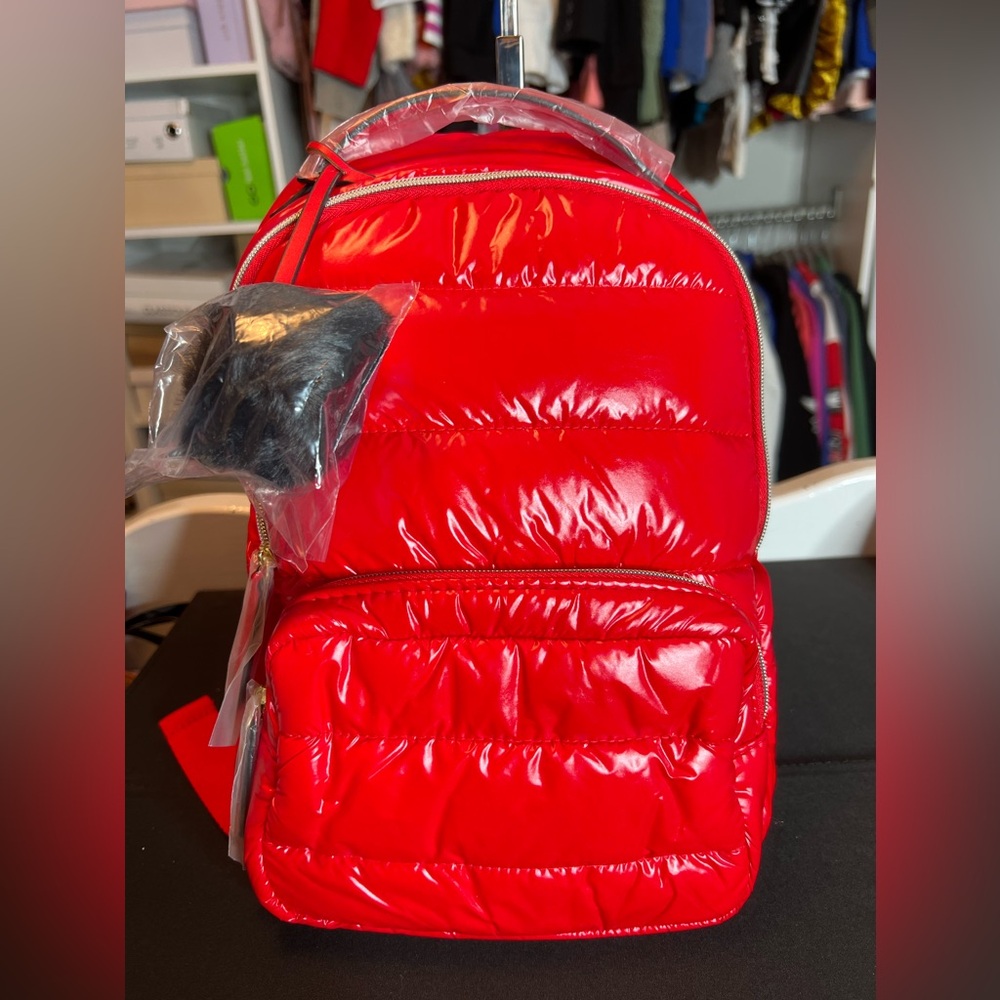 Estée Lauder red puffy backpack